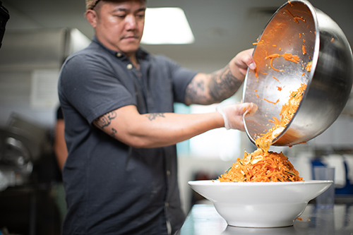 alex hanesakda pouring sauce